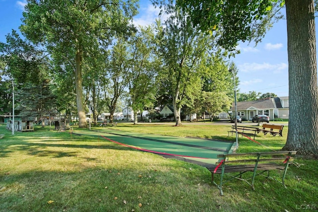 view of home's community featuring a yard and a residential view