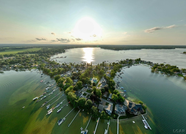 aerial view at dusk with a water view