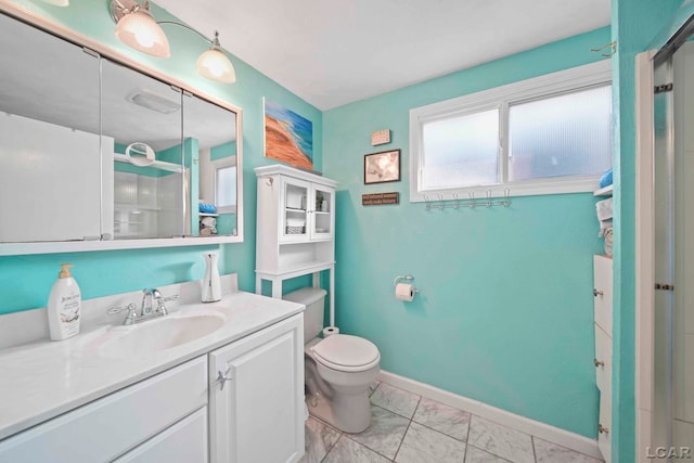 full bath featuring vanity, toilet, marble finish floor, baseboards, and a shower