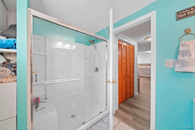 bathroom with a shower stall
