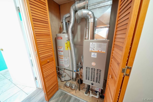 utility room featuring water heater