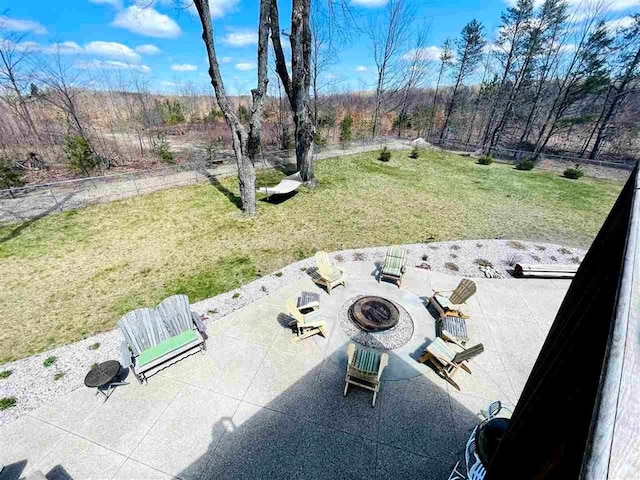 view of patio featuring a fire pit and fence
