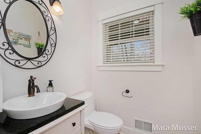 8821 Summerset Woods Ct SE, Alto, MI 49302 - half bath with toilet and vanity