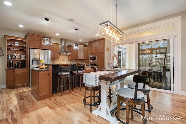 8821 Summerset Woods Ct SE, Alto, MI 49302 - dining area featuring light wood-style floors, recessed lighting, and baseboards