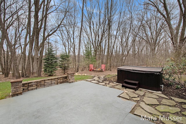 8821 Summerset Woods Ct SE, Alto, MI 49302 - view of patio / terrace with a hot tub