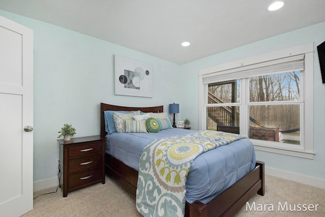 8821 Summerset Woods Ct SE, Alto, MI 49302 - bedroom with baseboards, light carpet, and recessed lighting
