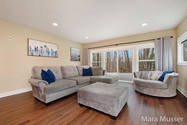 8821 Summerset Woods Ct SE, Alto, MI 49302 - living room with wood finished floors, baseboards, and recessed lighting
