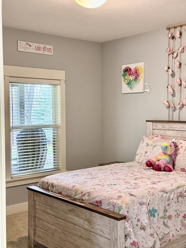 8821 Summerset Woods Ct SE, Alto, MI 49302 - carpeted bedroom featuring baseboards