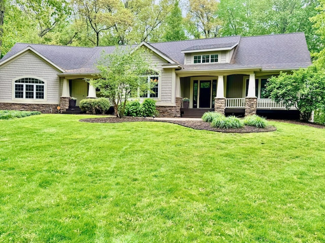 8821 Summerset Woods Ct SE, Alto, MI 49302 - craftsman house with stone siding, a front lawn, and a shingled roof