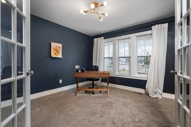 carpeted home office with baseboards, visible vents, french doors, and an inviting chandelier