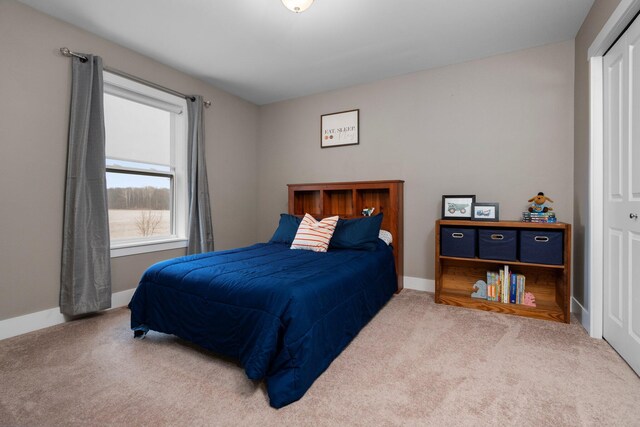 bedroom featuring baseboards and carpet flooring