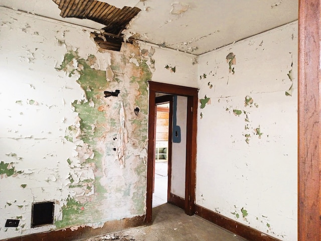6050 Vermont St, Detroit, MI 48208 - spare room featuring baseboards and unfinished concrete flooring
