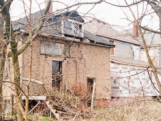 6050 Vermont St, Detroit, MI 48208 - view of home's exterior with roof with shingles and a chimney