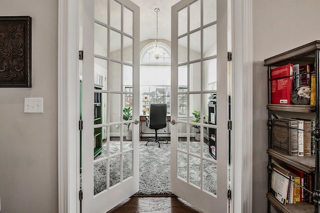 2667 Oxford Cir, Ann Arbor, MI 48103 - office space featuring french doors, lofted ceiling, a chandelier, and dark wood-style flooring