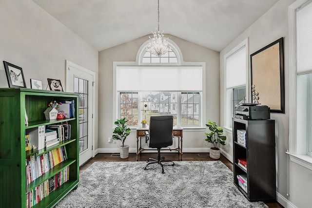 2667 Oxford Cir, Ann Arbor, MI 48103 - home office with a chandelier, vaulted ceiling, dark wood-style floors, and baseboards