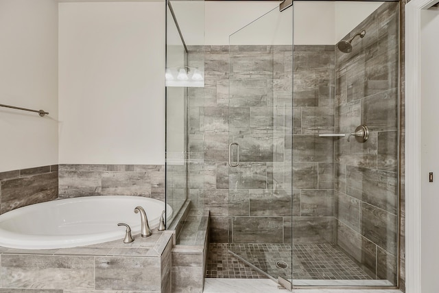 2667 Oxford Cir, Ann Arbor, MI 48103 - full bathroom featuring a bath and a shower stall