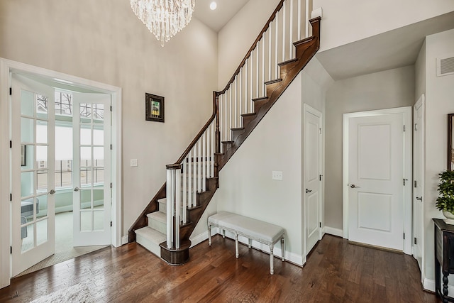 2667 Oxford Cir, Ann Arbor, MI 48103 - foyer entrance featuring french doors, stairway, wood finished floors, a chandelier, and baseboards