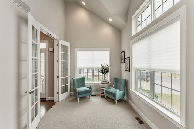 2667 Oxford Cir, Ann Arbor, MI 48103 - sitting room with french doors, high vaulted ceiling, baseboards, recessed lighting, and carpet