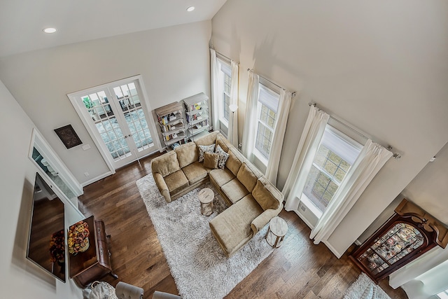 2667 Oxford Cir, Ann Arbor, MI 48103 - living room with a towering ceiling, wood finished floors, recessed lighting, french doors, and baseboards