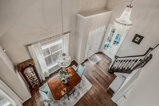 2667 Oxford Cir, Ann Arbor, MI 48103 - foyer entrance featuring a high ceiling, a chandelier, wood finished floors, and baseboards