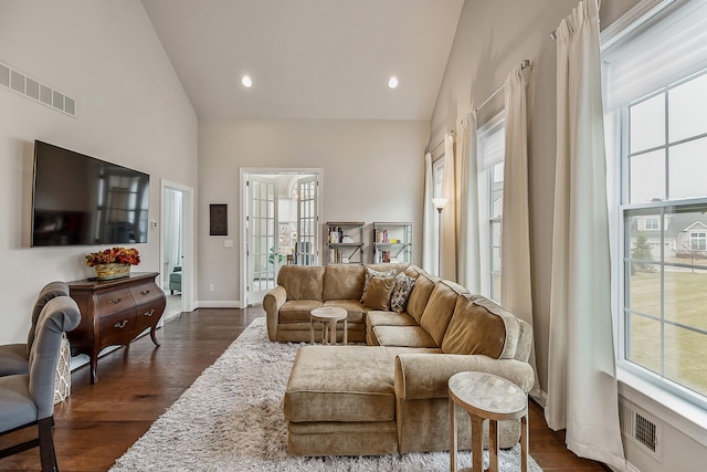 2667 Oxford Cir, Ann Arbor, MI 48103 - living area with healthy amount of natural light, high vaulted ceiling, dark wood finished floors, baseboards, and recessed lighting