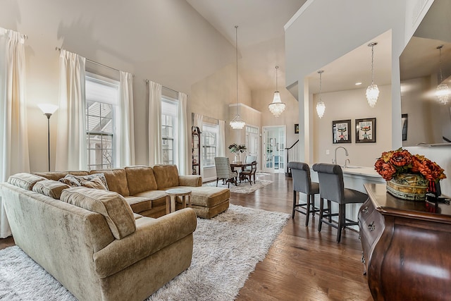 2667 Oxford Cir, Ann Arbor, MI 48103 - living area with high vaulted ceiling and dark wood-style flooring