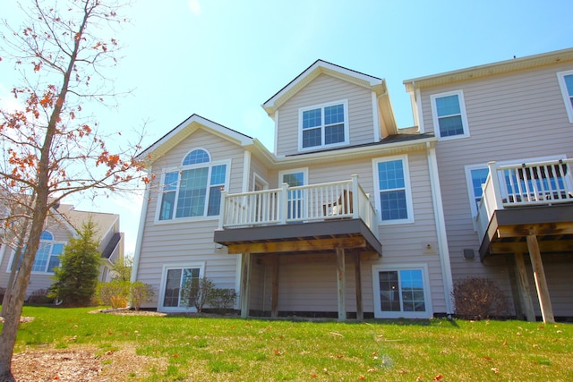 2667 Oxford Cir, Ann Arbor, MI 48103 - back of house with a yard and a balcony