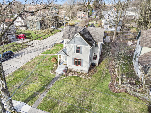 birds eye view of property with a residential view