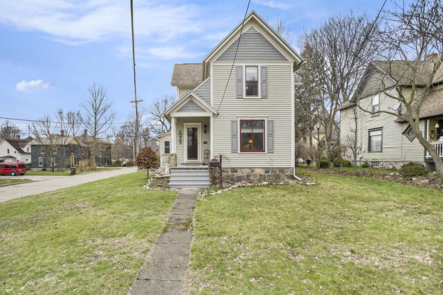 view of front of property with a front lawn