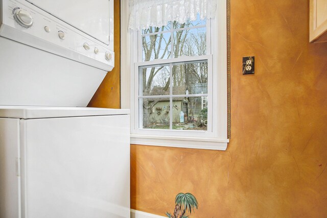 interior details with stacked washer / drying machine