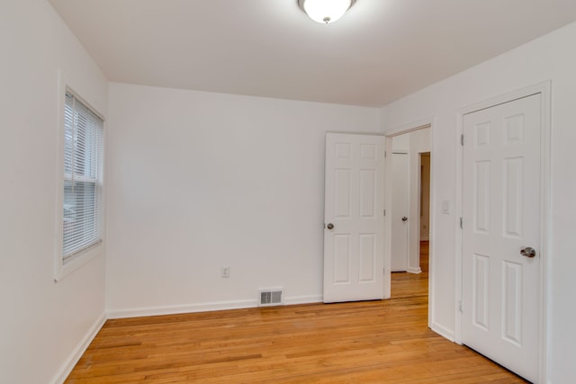 11135 Courville St, Detroit, MI 48224 - unfurnished bedroom with light wood-style flooring, baseboards, and visible vents