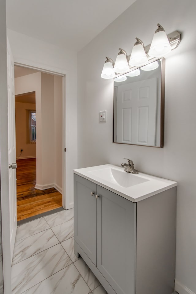 11135 Courville St, Detroit, MI 48224 - bathroom with marble finish floor, vanity, and baseboards