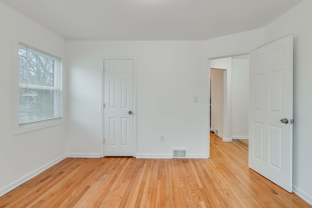 11135 Courville St, Detroit, MI 48224 - unfurnished bedroom featuring light wood finished floors, baseboards, and visible vents