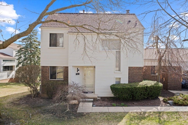 view of front of home featuring brick siding