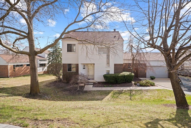 view of front facade featuring brick siding, a front lawn, a chimney, driveway, and an attached garage