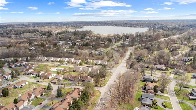 aerial overview of property's location featuring nearby suburban area and a large body of water