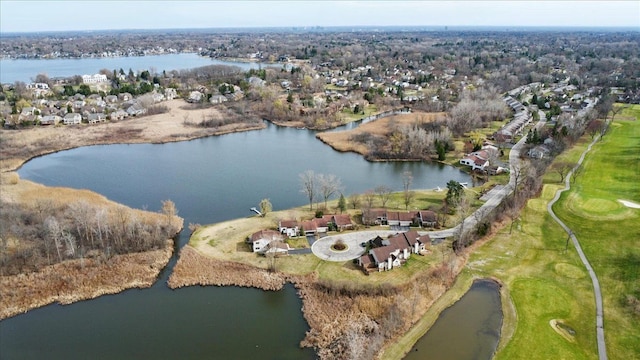 aerial overview of property's location featuring a large body of water, a golf club, and nearby suburban area