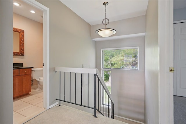 stairs with carpet flooring, baseboards, and recessed lighting