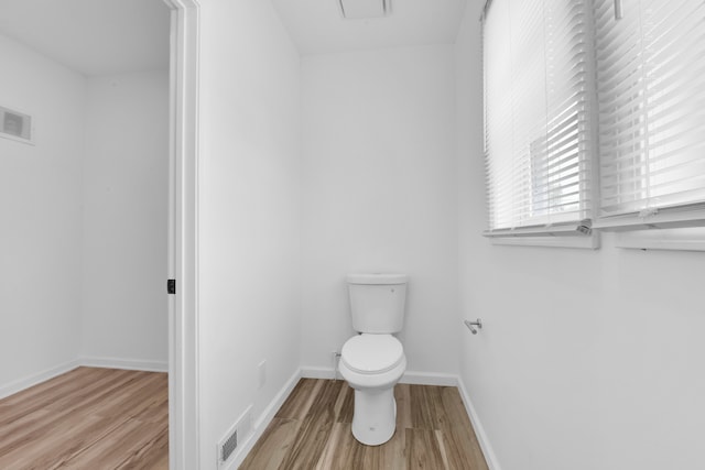 2916 Gladstone St, Detroit, MI 48206 - bathroom with baseboards, visible vents, wood finished floors, and toilet