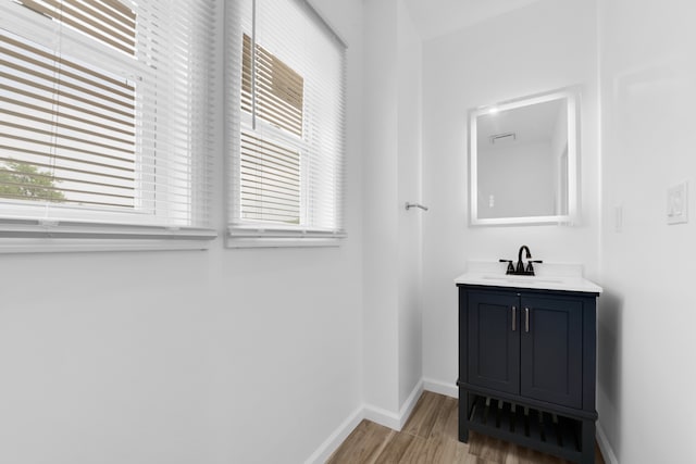 2916 Gladstone St, Detroit, MI 48206 - bathroom featuring baseboards, a wealth of natural light, and wood finished floors