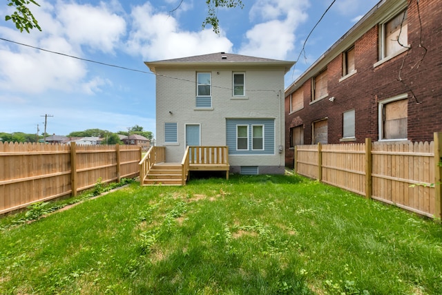 2916 Gladstone St, Detroit, MI 48206 - rear view of house with a fenced backyard, a yard, and a wooden deck