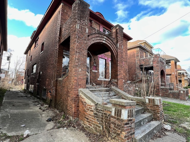 3741 Tyler St, Detroit, MI 48238 - view of front facade with a balcony and brick siding