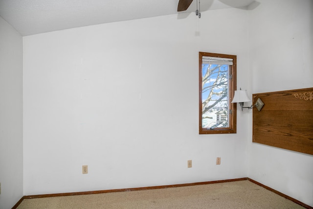 24199 N Shore Dr, Edwardsburg, MI 49112 - spare room featuring carpet floors, baseboards, lofted ceiling, and ceiling fan