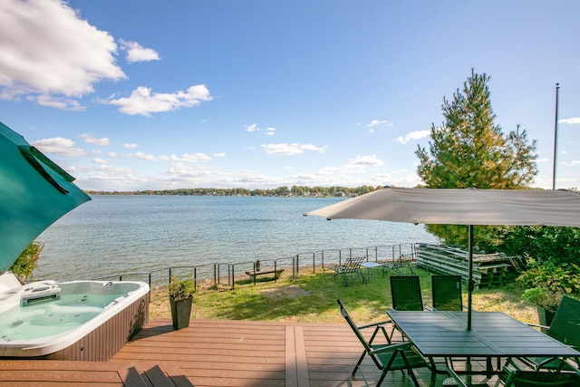 24199 N Shore Dr, Edwardsburg, MI 49112 - wooden terrace with hot tub deck surround, fence, a water view, outdoor dining space, and a yard