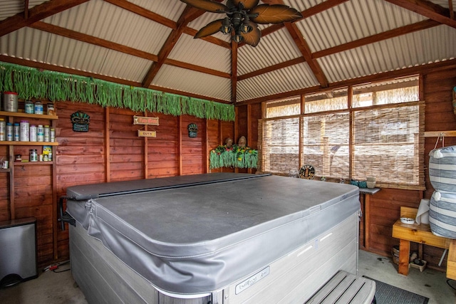 7042 Calkins Rd, Flint, MI 48532 - misc room with a ceiling fan, lofted ceiling, and wood walls