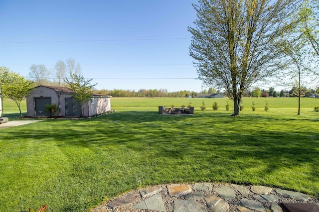 7042 Calkins Rd, Flint, MI 48532 - view of green lawn featuring an outdoor structure and a garage