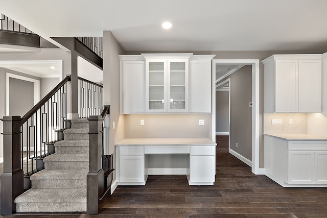 stairs featuring baseboards, wood finished floors, and recessed lighting