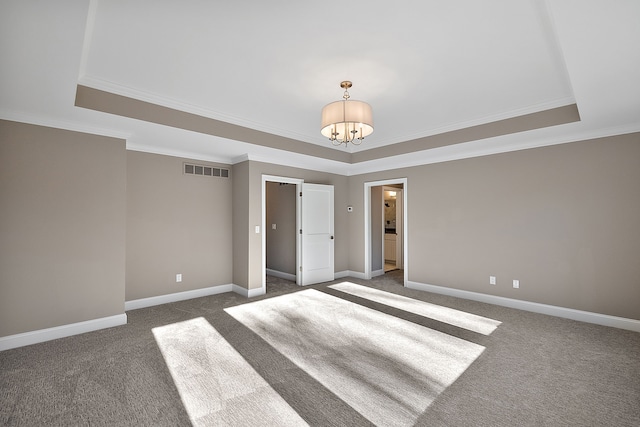 empty room with baseboards, visible vents, dark colored carpet, and a chandelier