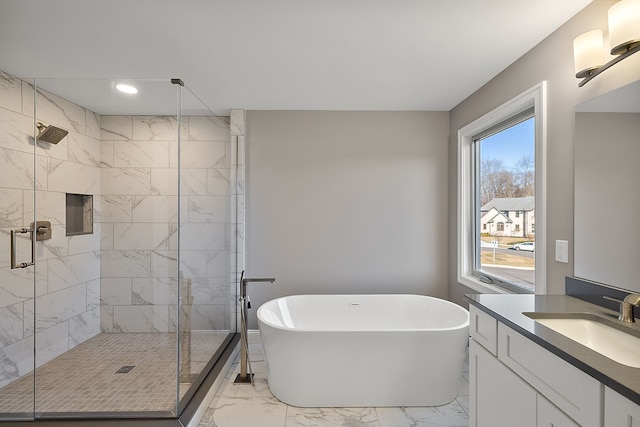 full bathroom with a freestanding tub, vanity, a shower stall, marble finish floor, and recessed lighting