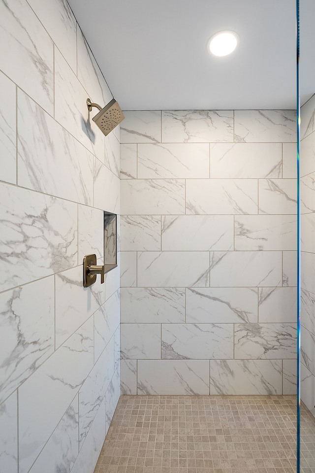 full bathroom with a tile shower